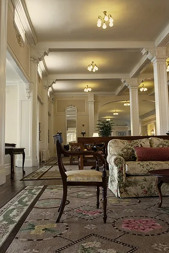 Traditional upholstered sofa and chair in a formal interior