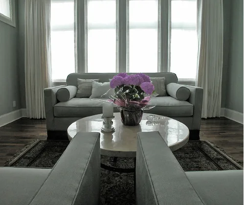 Upholstered sofa with coordinated draperies in a finished living room